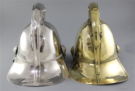 Two 19th century firemans helmets, height 10in.